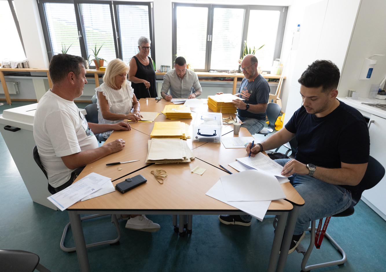 Postal ballots are seen being sorted by election staff in Esch-sur-Alzette, 11 June 2023. Photo: Guy Wolff/Maison Moderne