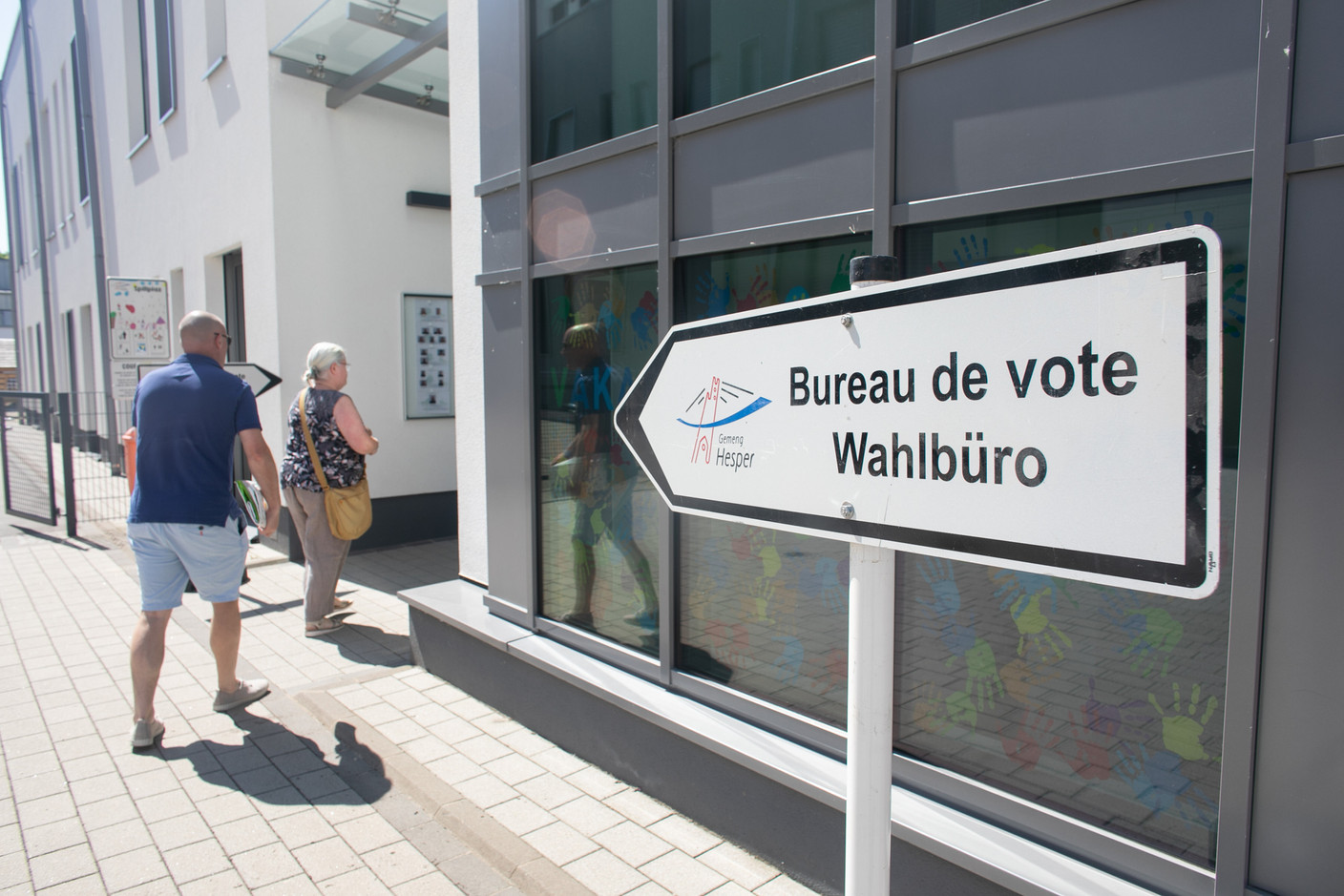 Voters are seen at a polling station in Hesperange, 11 June 2023. Photo: Maison Moderne