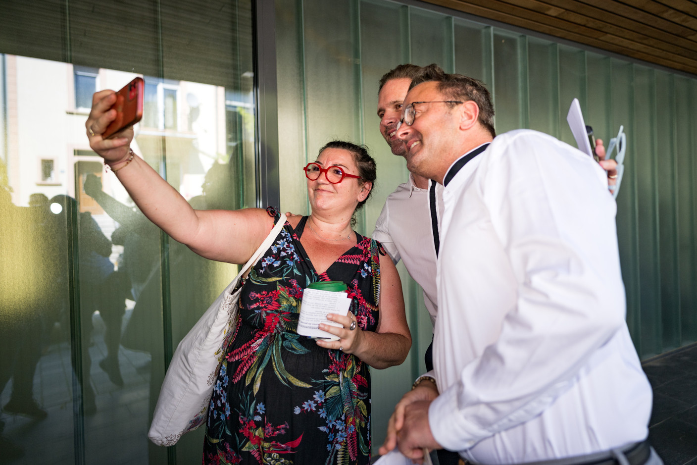A Luxembourg City voter takes a selfie with Xavier Bettel, Luxembourg’s prime minister, and his husband, outside a polling station during municipal elections, 11 June 2023. Photo: Nader Ghavami