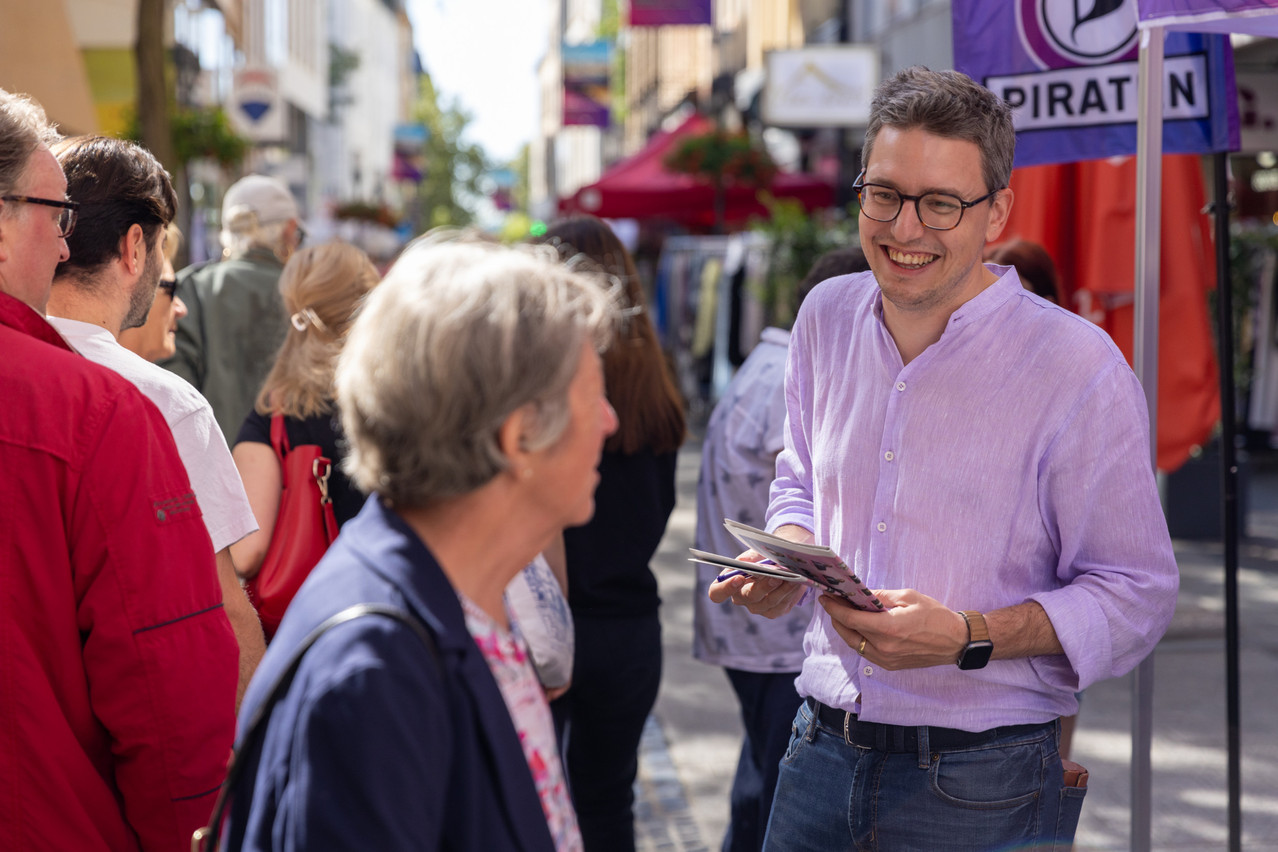 Sven Clement, aged 34, MP and Pirate party lead candidate. Library picture: Sven Clement is seen handing out campaign pamphlets during the Braderie street market in Luxembourg City-Centre, 4 September 2023.  Photo: Romain Gamba