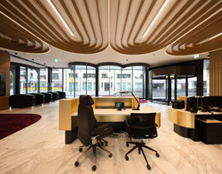 The bank’s reception area opens onto the street, creating a visual dynamic with passers-by. Photo: Guy Wolff/Maison Moderne