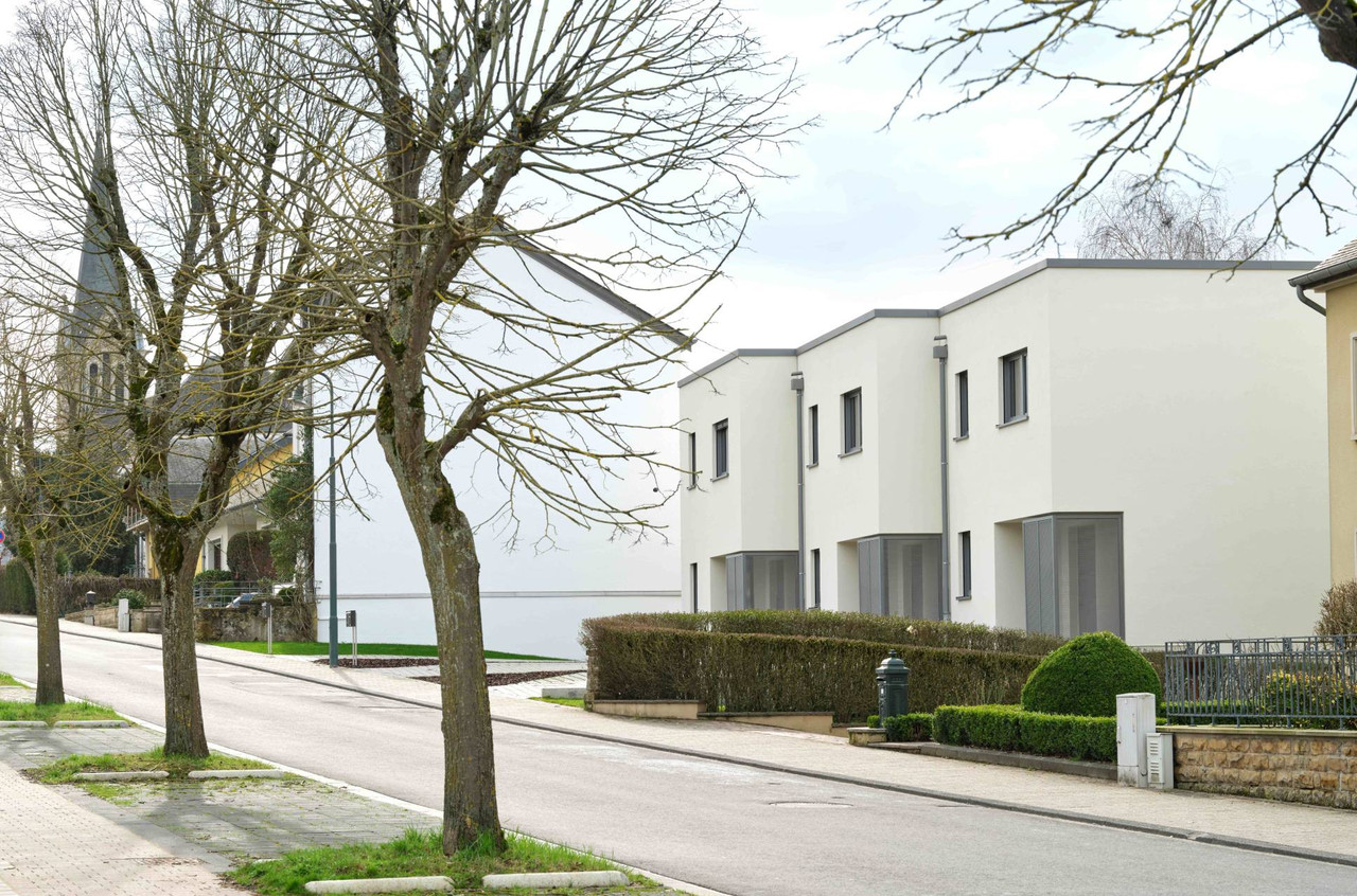 The three houses are slightly offset to follow the curve of the street. Photo: PlanetPlus