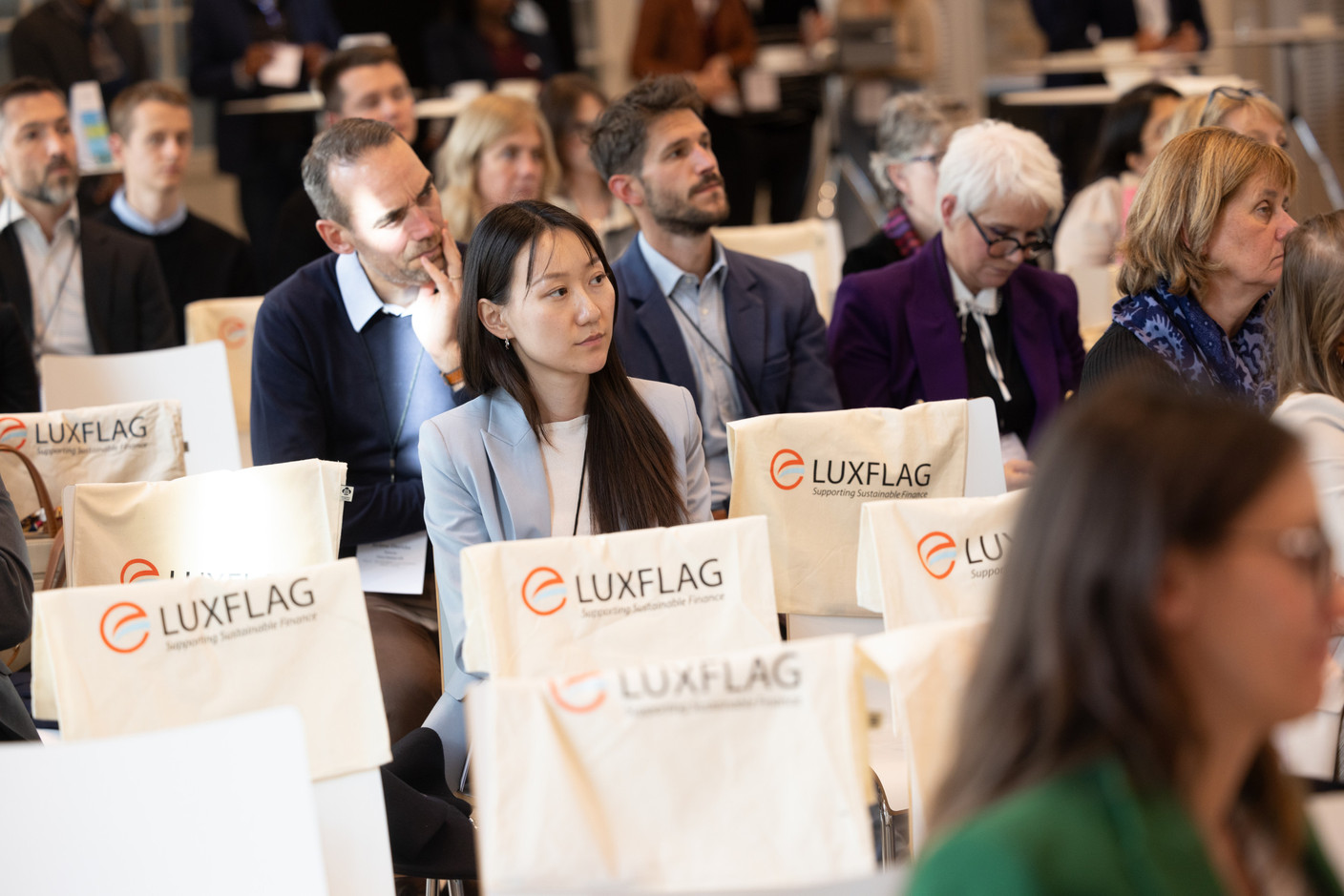 Attendees are seen during Luxflag Sustainable Investment Week, held at the Schéiss cultural centre, 18 October 2023. Photo: Guy Wolff/Maison Moderne