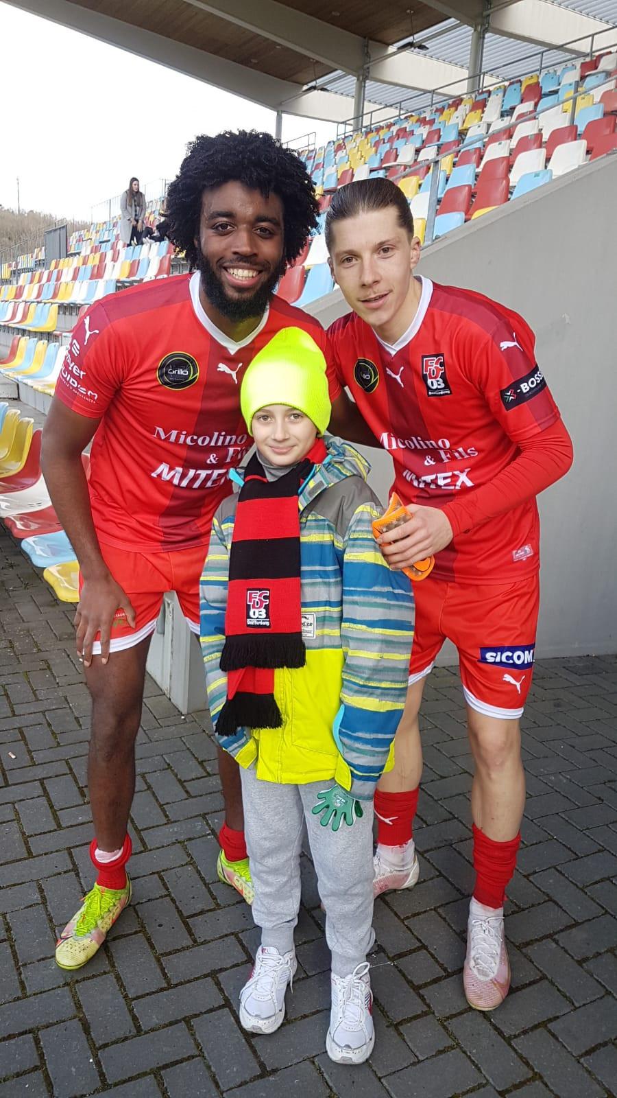 9-year-old Luka pictured with Differdange club footballers during his visit to the stadium where he was welcomed by the team and president of the club.   Provided by Kozyrev