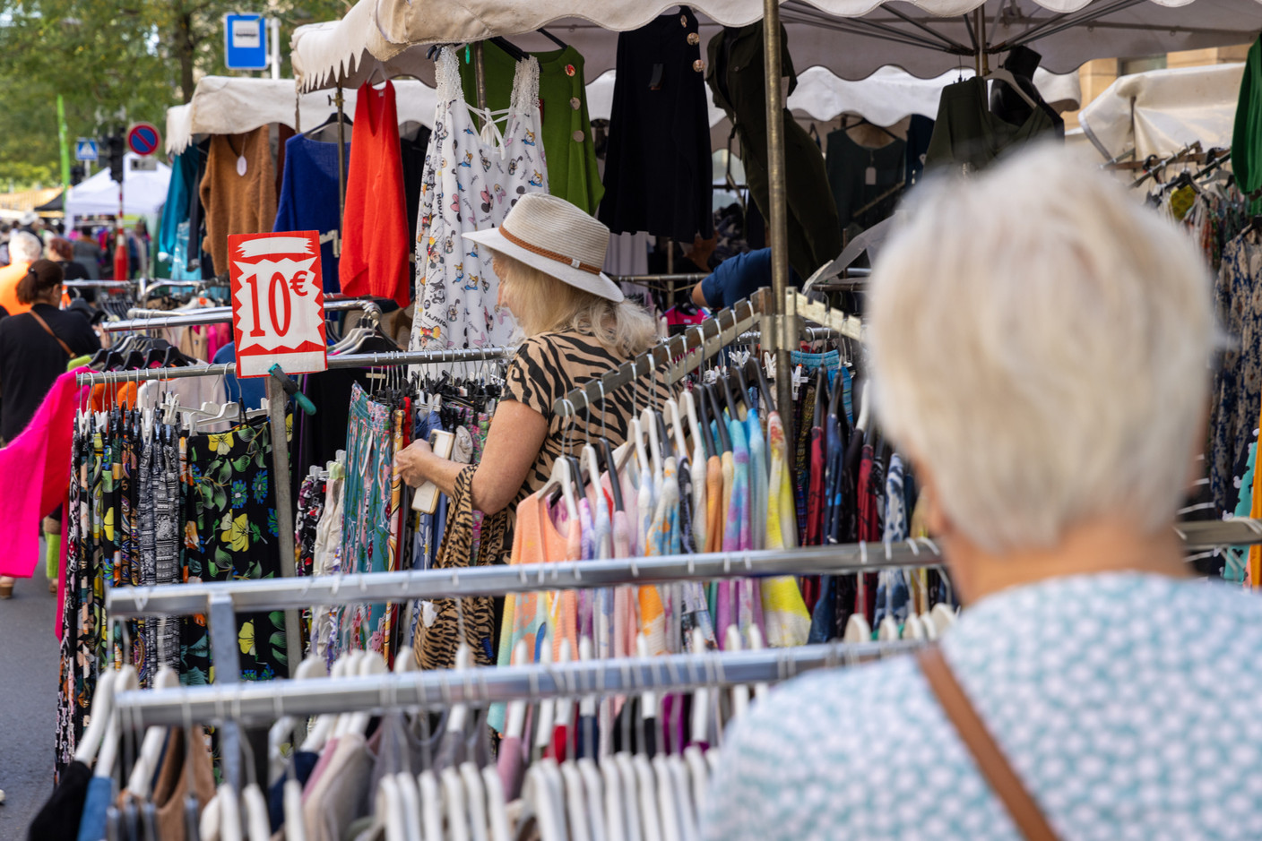 Shoppers and stallholders are seen in the Gare district during the braderie (street market) in Luxembourg City, 4 September 2023. Photo: Romain Gamba / Maison Moderne