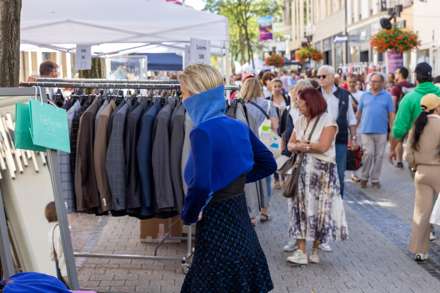 Shoppers and stallholders are seen in Luxembourg City-Centre during the braderie (street market), 4 September 2023. Photo: Romain Gamba / Maison Moderne