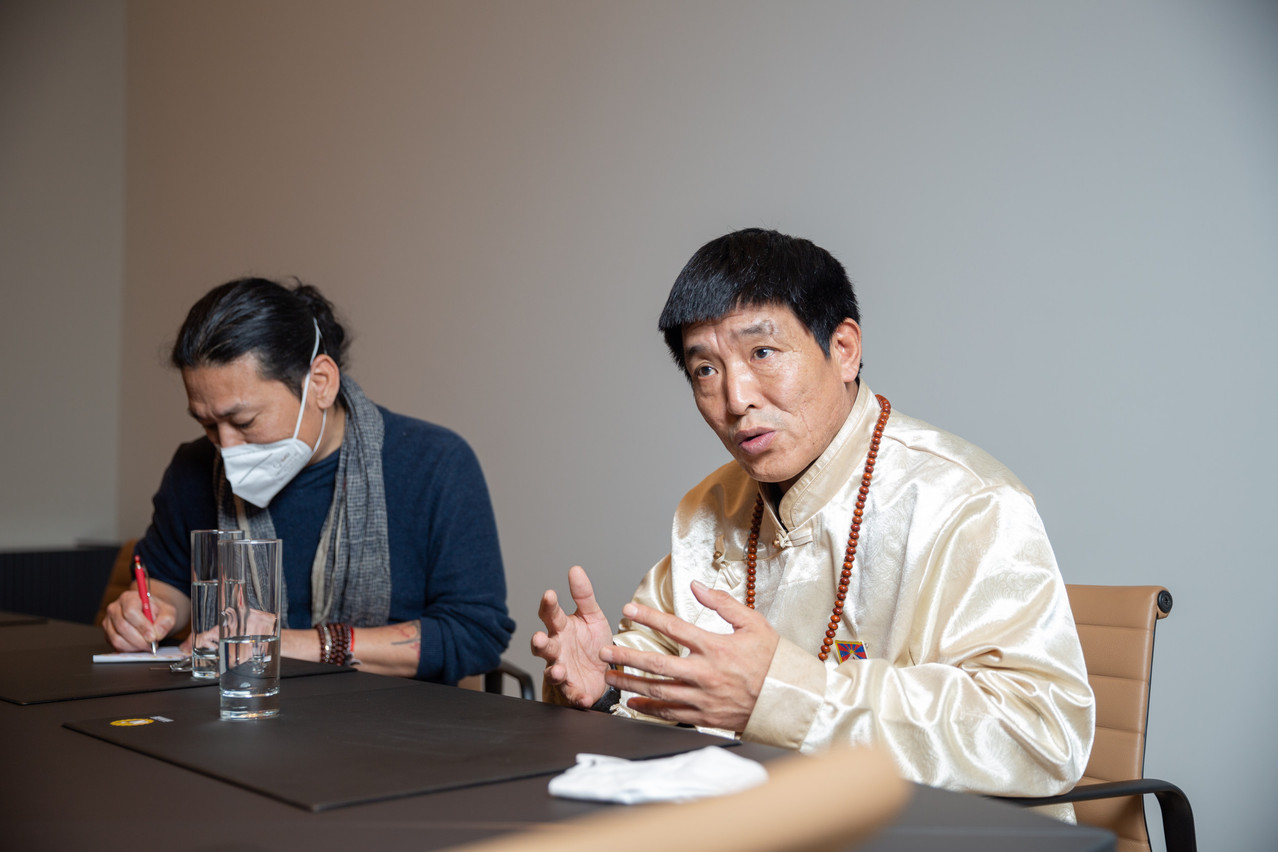 Dhondup Wangchen with his interpreter Photo: Romain Gamba / Maison Moderne