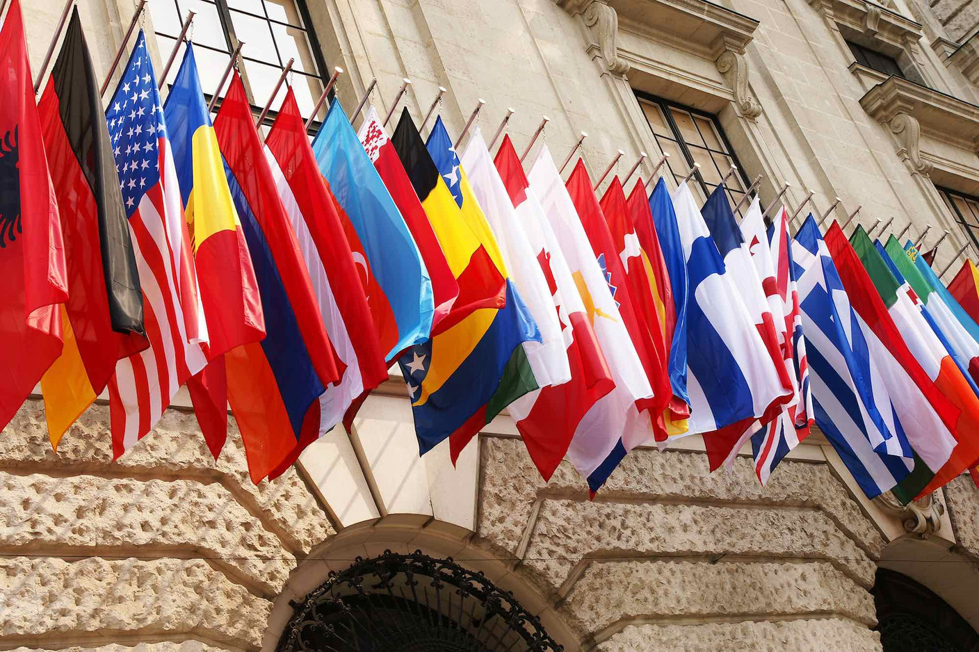 The Organisation for Economic Co-operation and Development stated that single Luxembourg workers paid tax rates that were more than double of those for married couples in 2021. Pictured: Flags of OECD members. Photo credit: Shutterstock/Johanna Muehlbauer