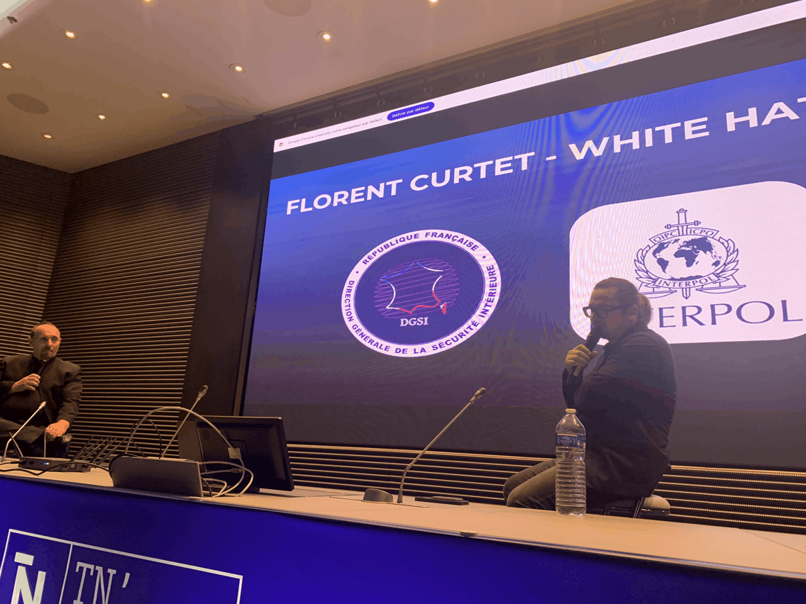 Florent Curtet (right) speaks at the event. Off to the left side is Pierre Penalba, the former French police officer who helped arrest Curtet in 2006. Photo: Ioanna Schimizzi/Maison Moderne
