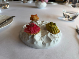 Savoury courgette and Comté cheese madeleines, tartlets with cream and pickled radishes, and soufflé pizza: Chef Milan Brée’s appetisers at La Cristallerie. Photo: Emilie Gline/Paperjam