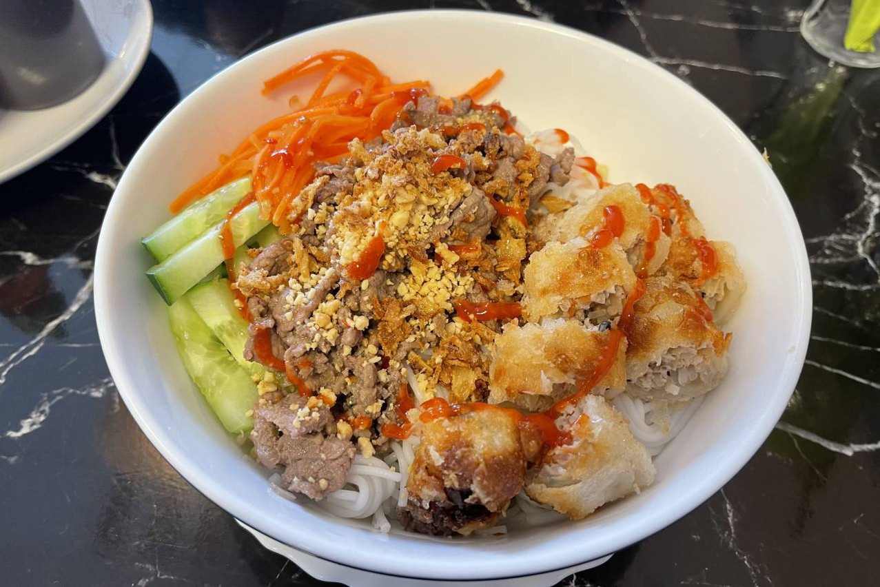 Mr. Mai’s bò bún is seductive: rice vermicelli, melting marinated beef, crispy egg rolls, crunchy vegetables and fresh herbs, all topped with a perfectly balanced homemade sauce. Photo: Paperjam
