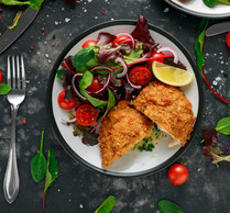 Chicken Kyiv. Ingredients (provided by Chiche!) include: chicken breast, butter, garlic, parsley, dill, eggs, flour, panko breadcrumbs, potato, milk, pickles   DronG/Shutterstock