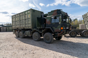 Trucks and containers move around the Lithuanian base. (Photo: Emmanuel Claude/SIP)
