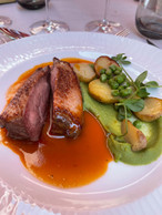 Honey-lacquered duck breast, pea pommade, picalilli poultry juice and sautéed baby potatoes. Photo: Paperjam