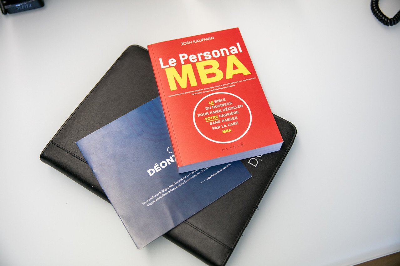 “The Personal MBA” by Josh Kaufman and a copy of the Federation for Recruitment, Search & Selection’s code of ethics. Photo: Romain Gamba