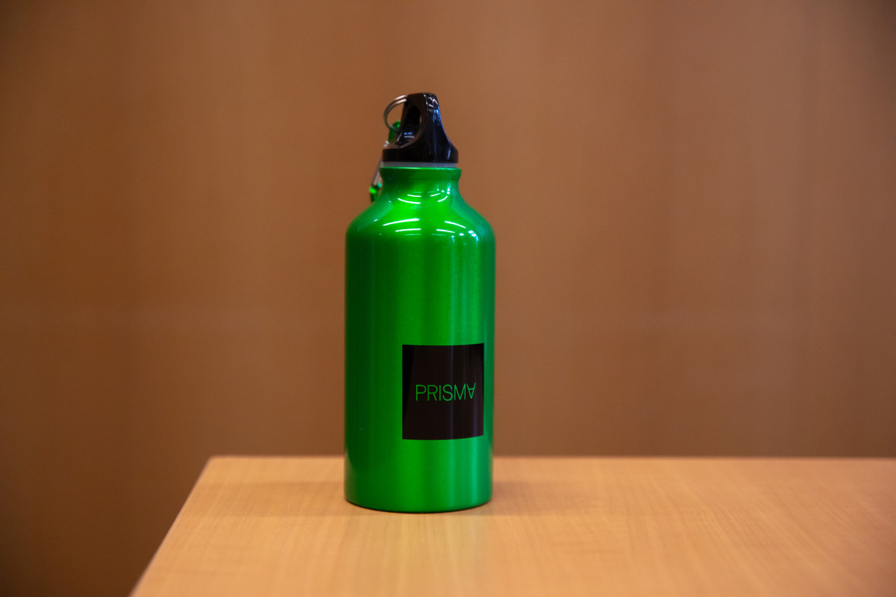 One of the company-branded water bottles that will be donated to charity. Photo: Matic Zorman
