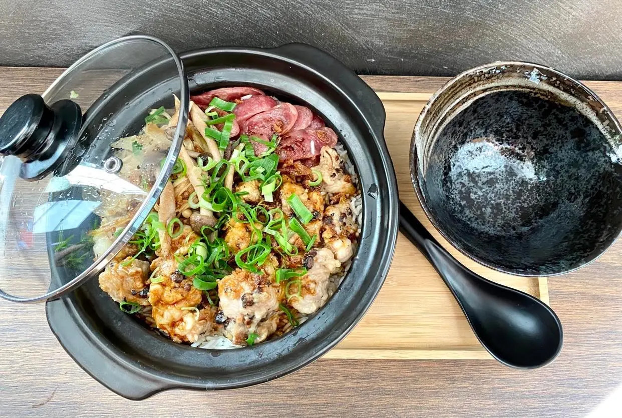 A must-try is the eponymous dish, a typical Hong Kong dish made with rice, Chinese sausage and bok choy, all served in a clay pot. Photo: Bo Zai Fan