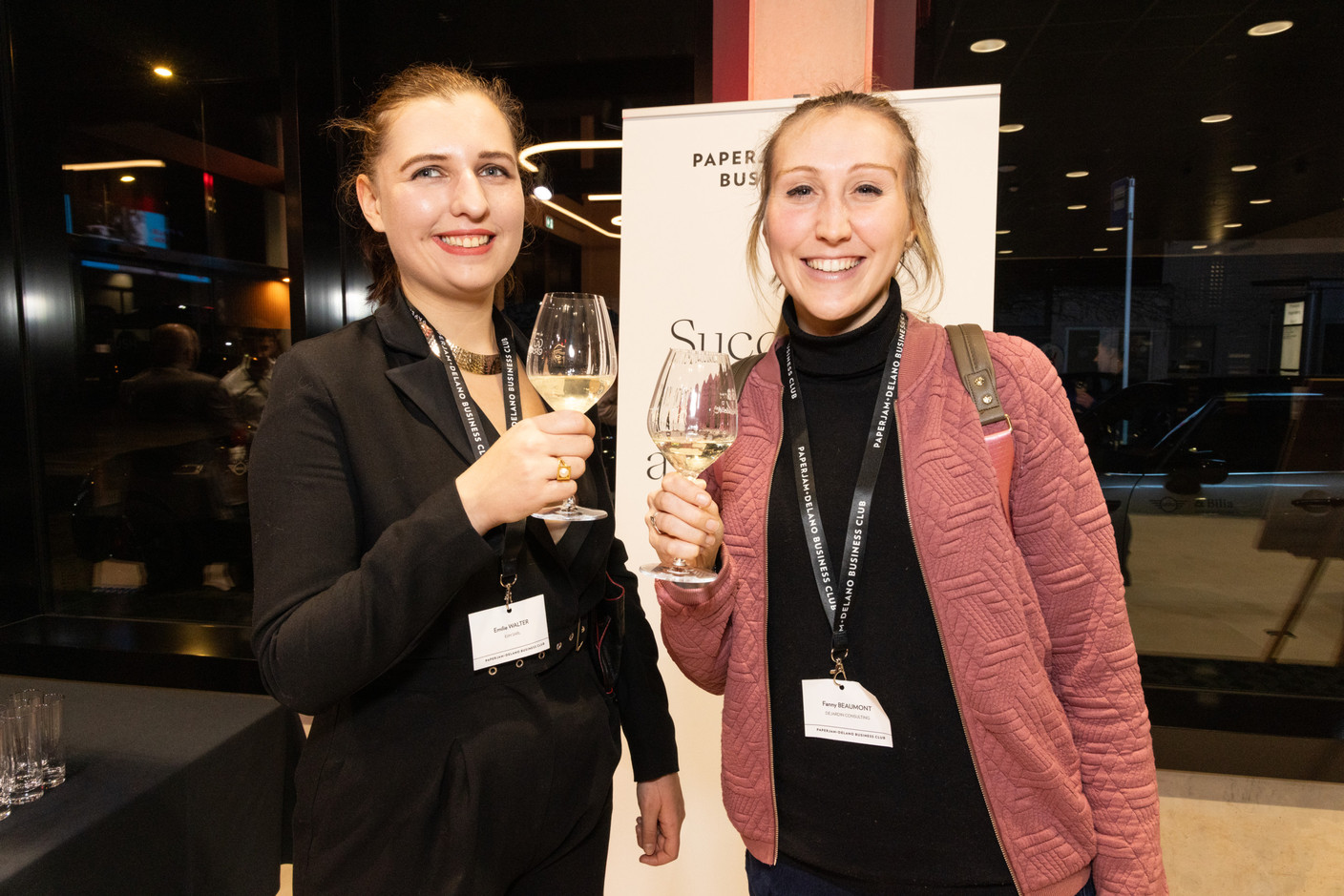 Emilie Walter (E2M SARL) and Fanny Beaumont (Dejardin Consulting) during the women-on-winetasting event at the Mini dealership in Cloche d’Or on Thursday 25 January 2024. Photo: Marie Russillo/Maison Moderne
